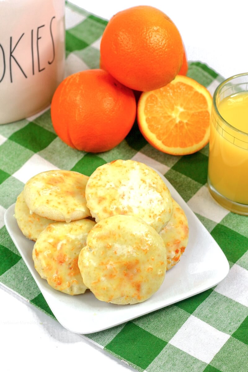 orange cookies with oranges and orange juice