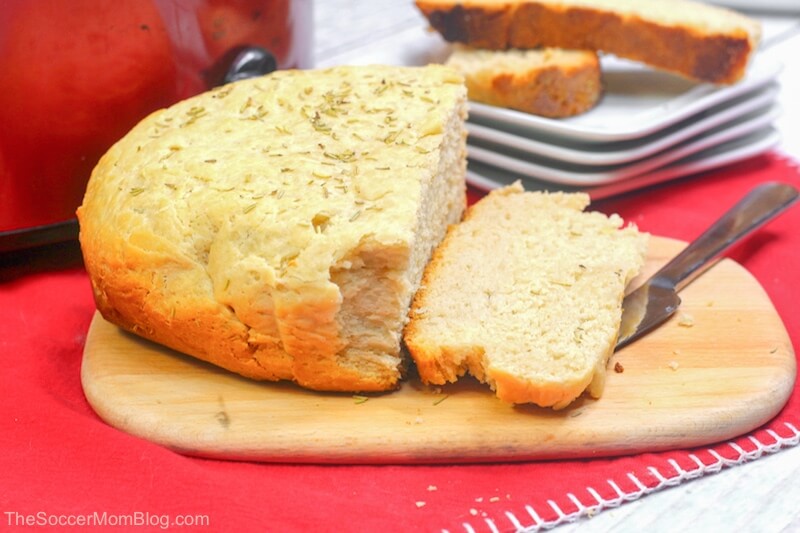 a loaf of slow cooker bread, sliced on cutting board