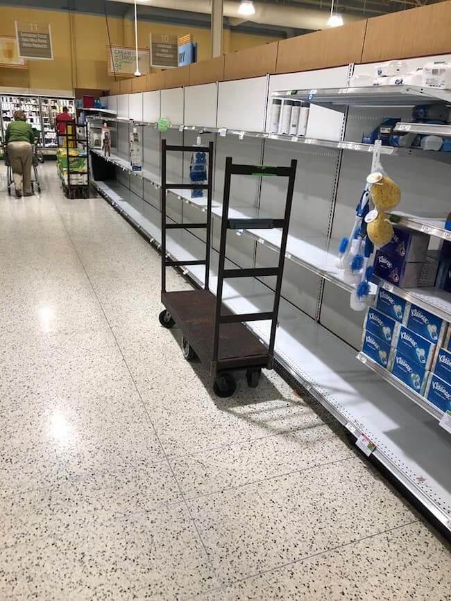 empty toilet paper shelves at grocery store