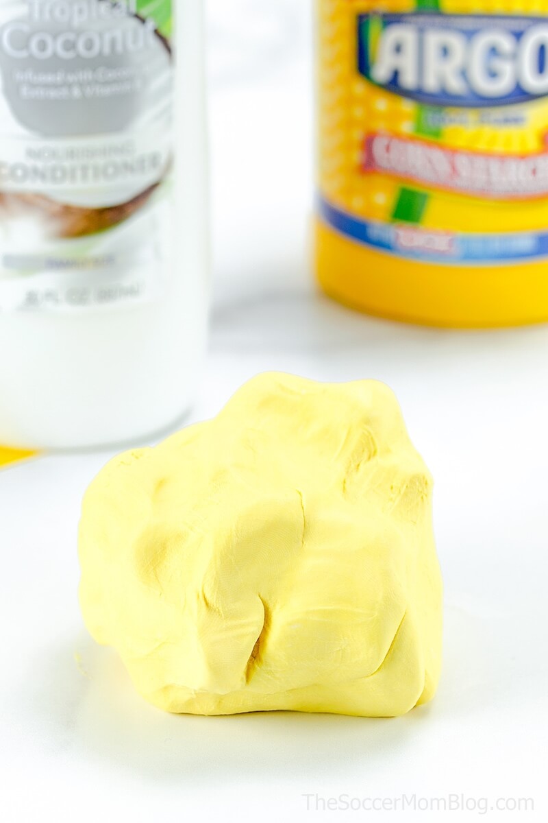 ball of yellow play dough with conditioner & cornstarch