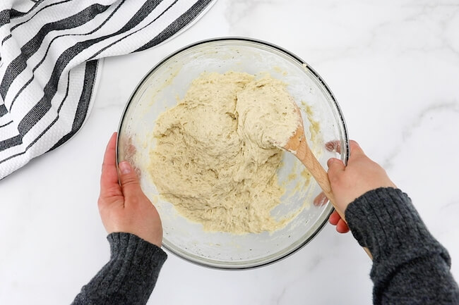 mixing quick bread dough with wooden spoon