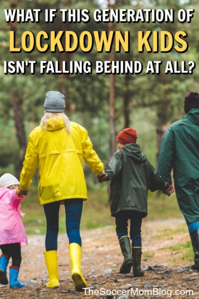 family walking in the woods in raincoats