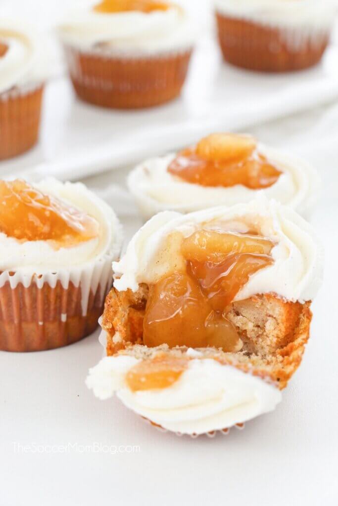 apple pie filled cupcakes cut in half to reveal the filling