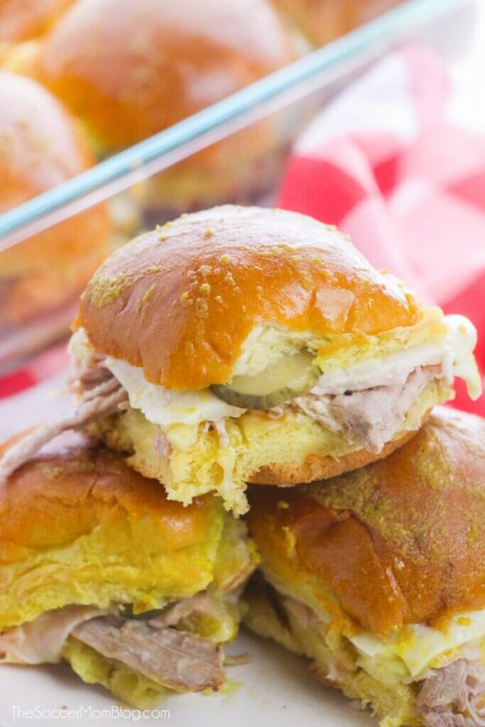 Cuban sandwich sliders with roasted pork, ham, pickles, and cheese