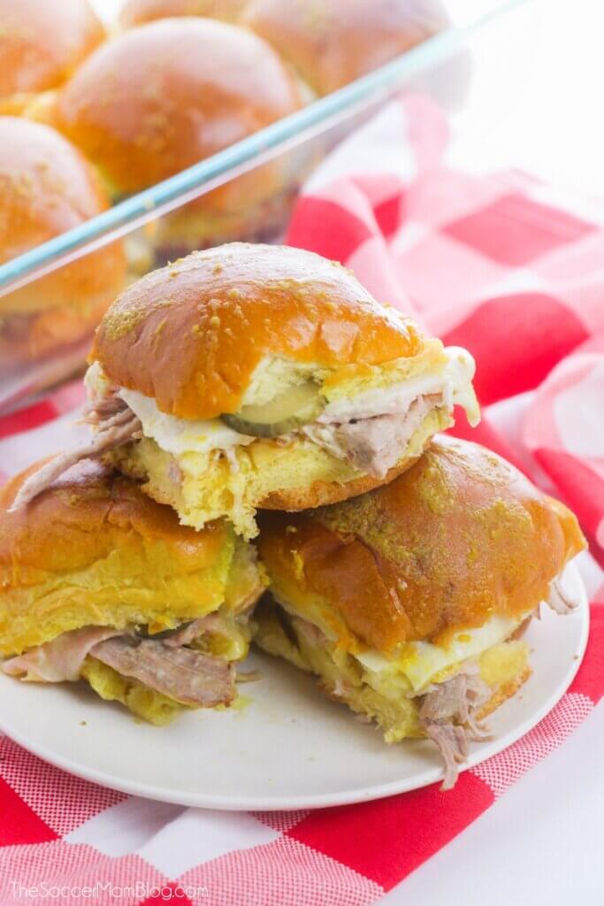 baked Cuban sliders stacked on plate