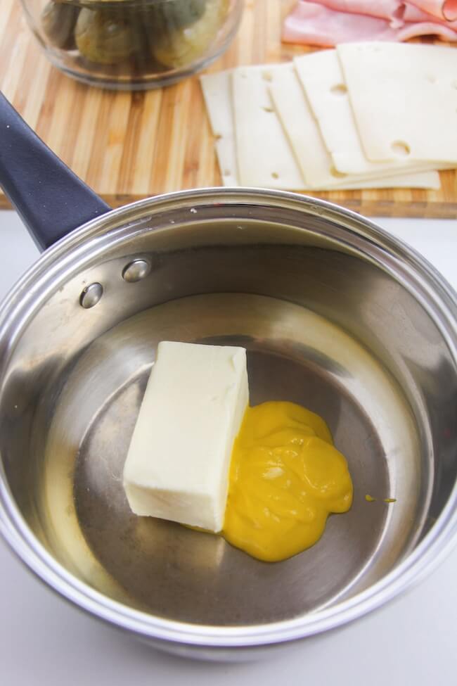 melting butter and mustard in a saucepan