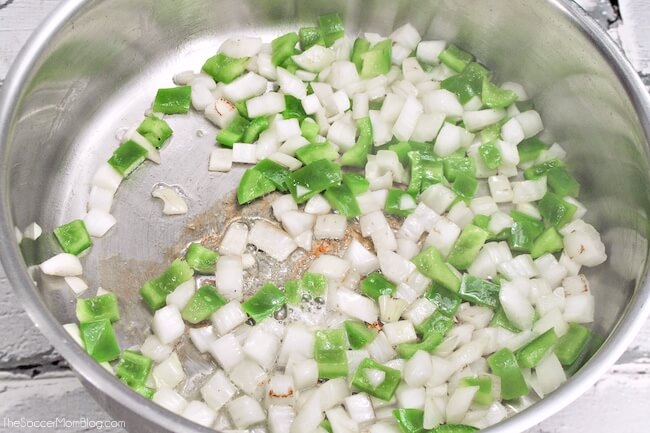 diced onions and peppers cooking in an Instant Pot