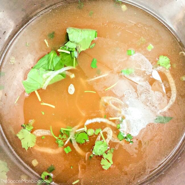 beef pho broth cooking in Instant Pot