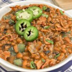 These amazing Sweet & Spicy Instant Pot Baked Beans are hearty enough to be a meal, but make for a mind-blowing side too!