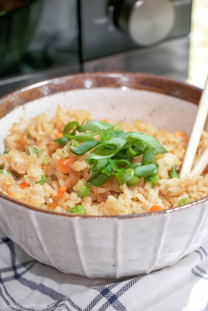 microwave fried rice in bowl with chopsticks