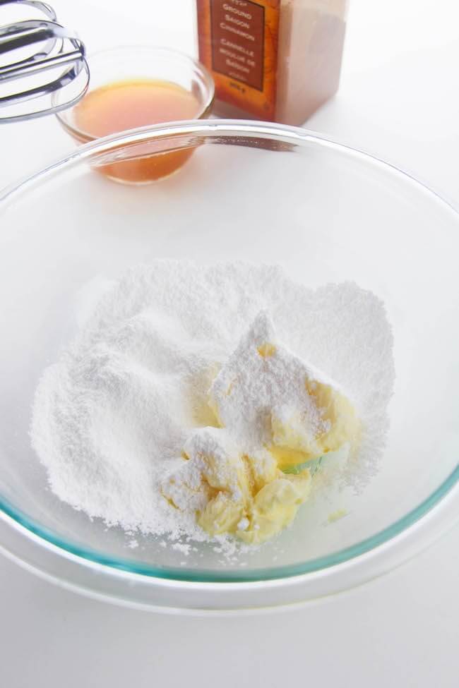 powdered sugar and butter in mixing bowl