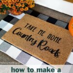 homemade doormat on porch with flowers