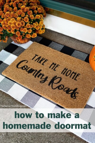 homemade doormat on porch with flowers