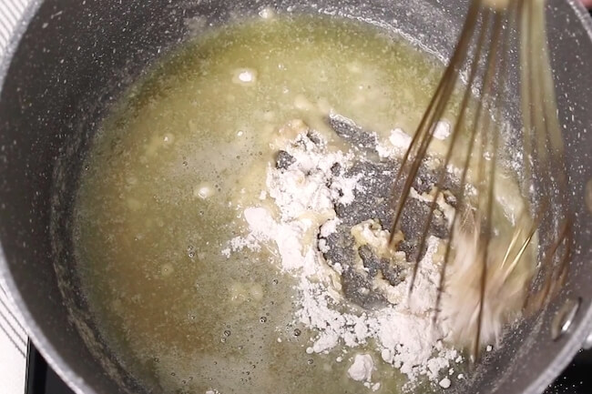 stirring flour into butter to make gravy