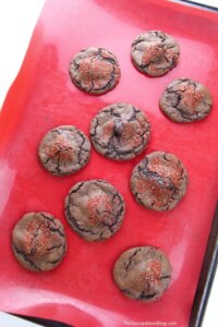 fresh baked chocolate cherry cookies on baking sheet