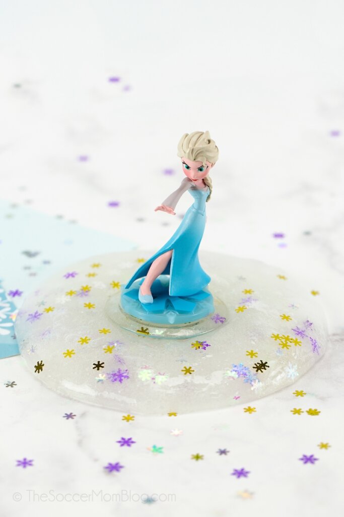 Elsa figurine standing in a puddle of snowflake slime