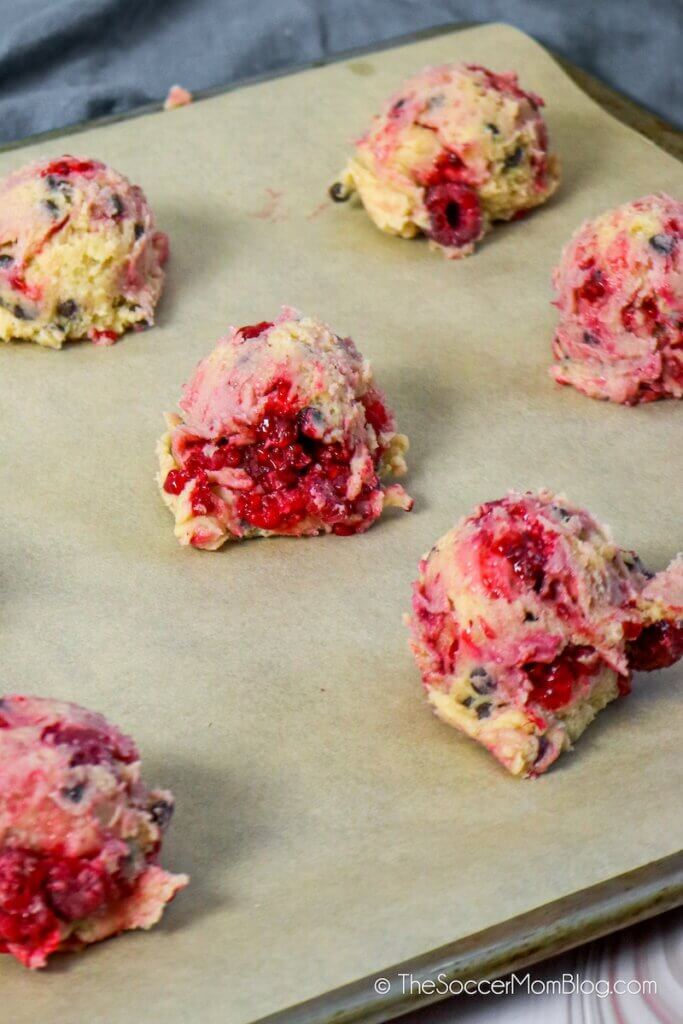 raspberry chocolate chip cookie dough on baking sheet