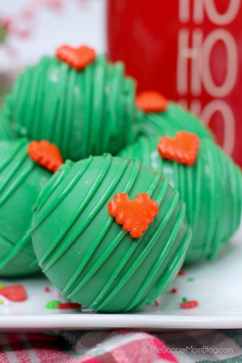 Festive green hot cocoa bombs inspired by the Grinch!