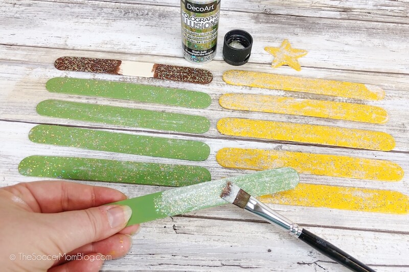 painting craft sticks with glitter glue