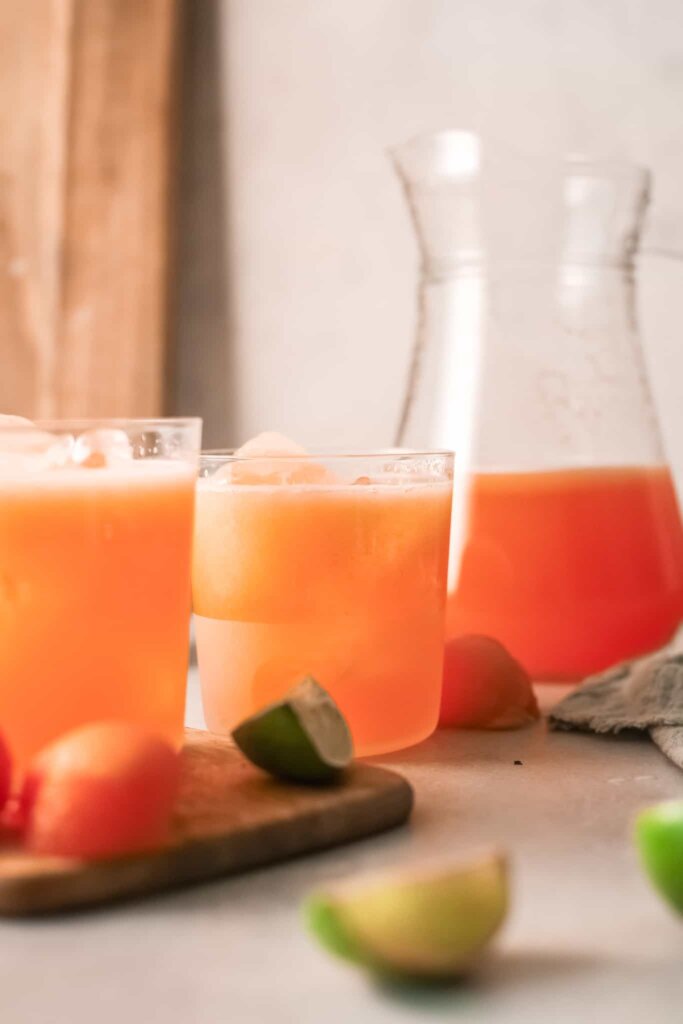 fruity agua fresca in pitcher and glasses