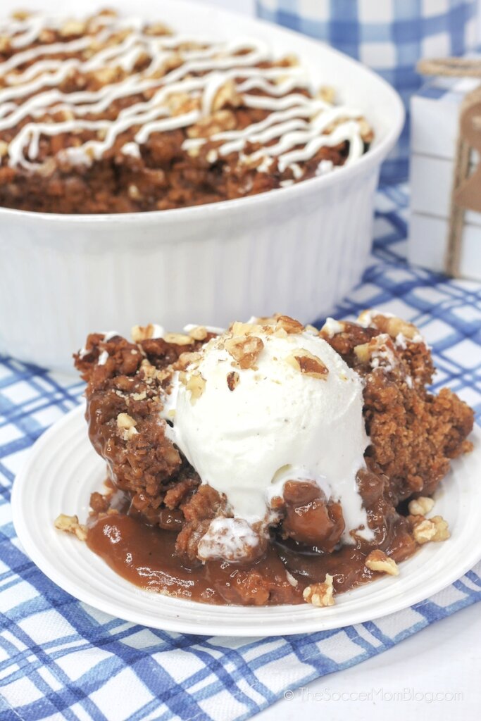 warm and gooey carrot cake cobbler on plate topped with ice cream