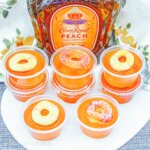 peach jello shots made with Crown Royal and peach rings candy