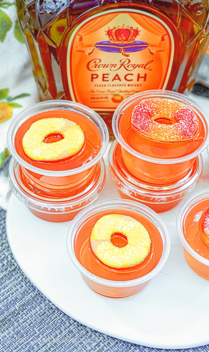 close up of peach jello shots with Peach rings candy