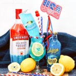 bright blue electric lemonade cocktail with patriotic decorations