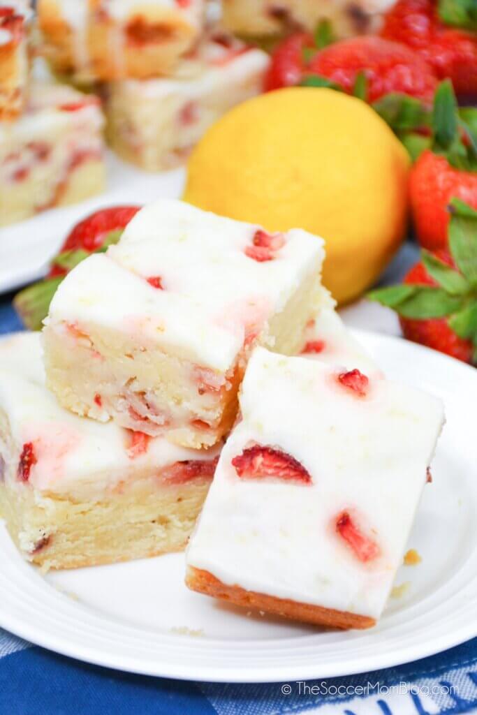 Strawberry Lemon Bars stacked decoratively on a plate
