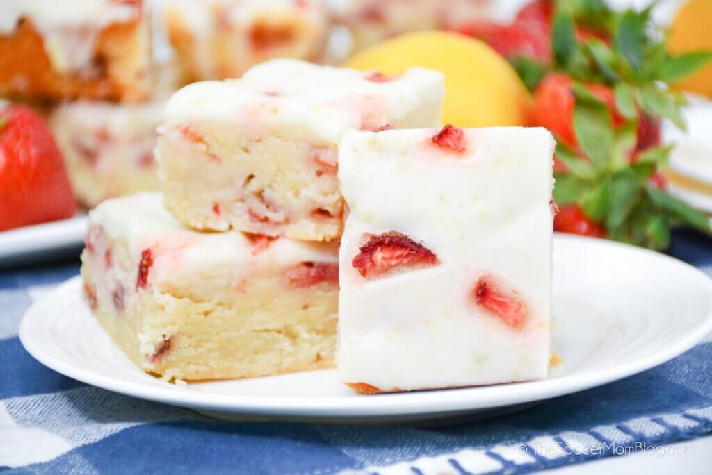 Strawberry Lemon Bars stacked on a plate for display