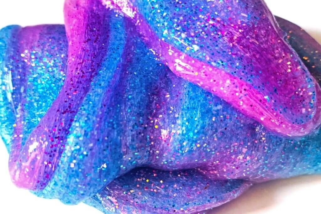 glitter galaxy slime purple and blue