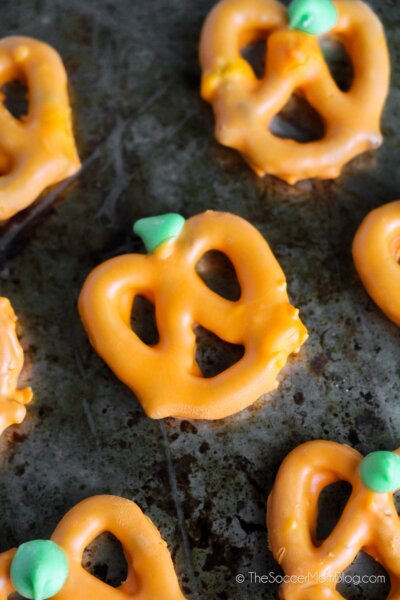 pretzels dipped in chocolate to look like pumpkins