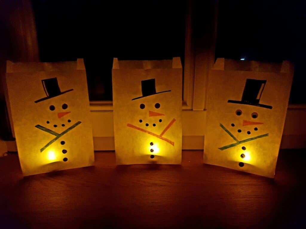 paper bag snowmen with tea lights inside