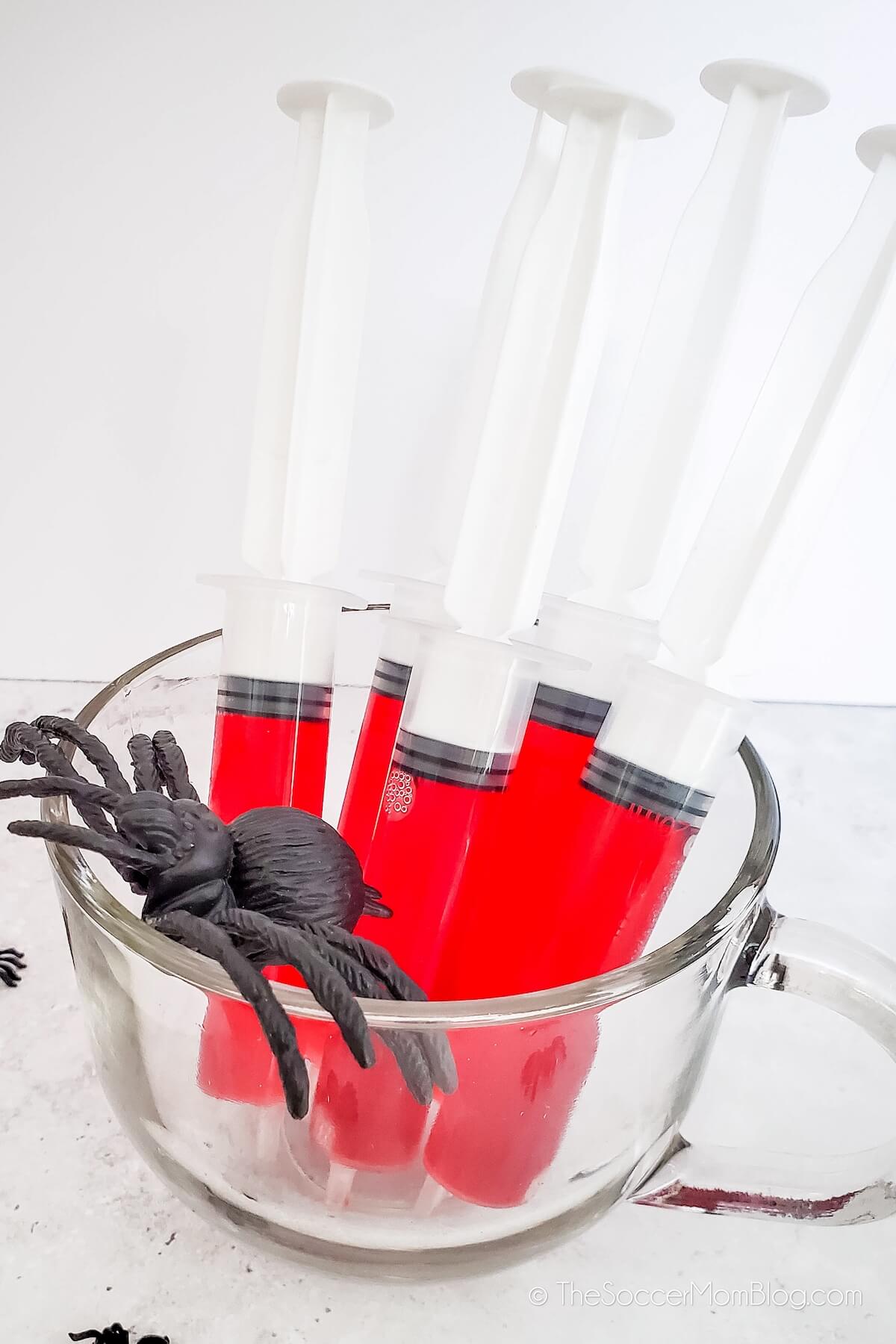 Halloween jello shot syringes that look like they're filled with blood