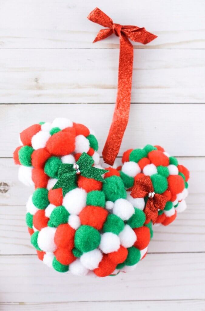 Mickey Mouse ornament made with red green and white pom poms
