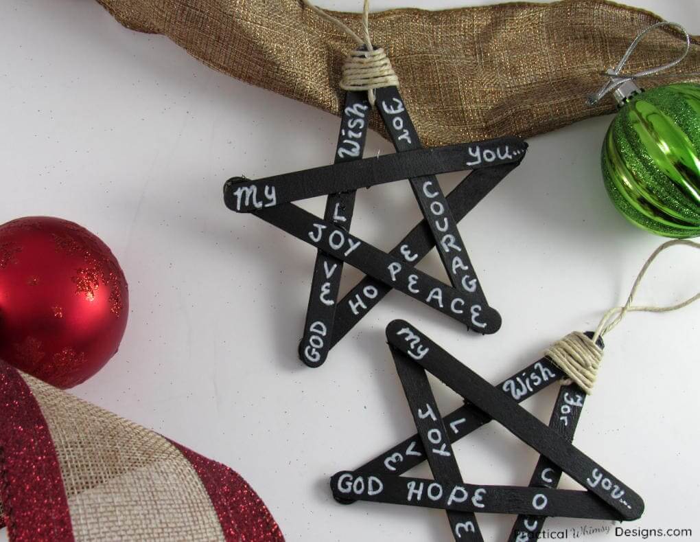 popsicle sticks painted black, glued in star shapes, with words 