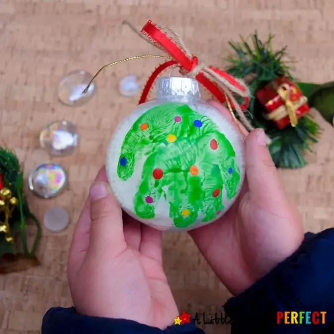 round glass ornament with child's handprint