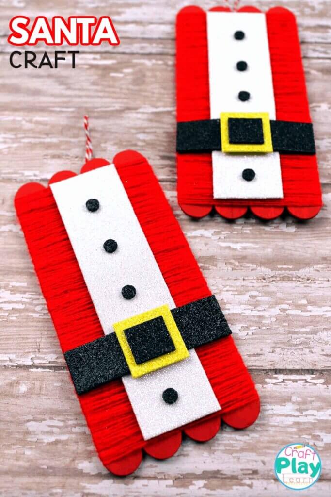 popsicle sticks decorated to look like Santa's shirt and belt