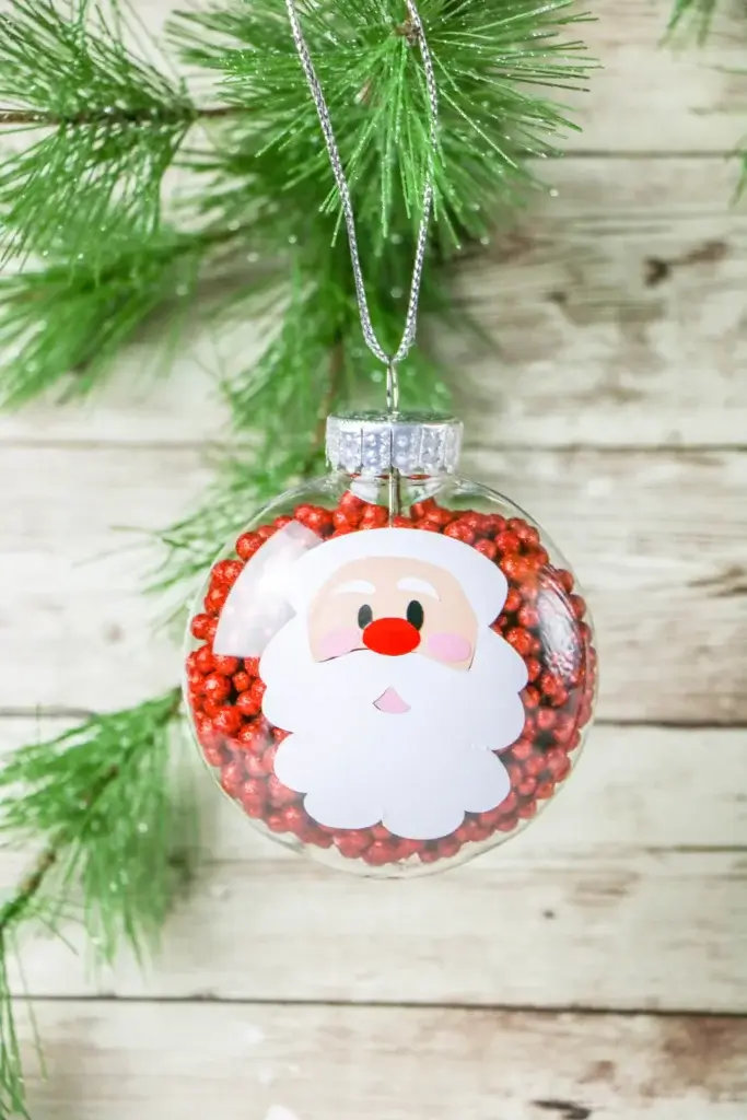 glass ornament with Santa's face on front