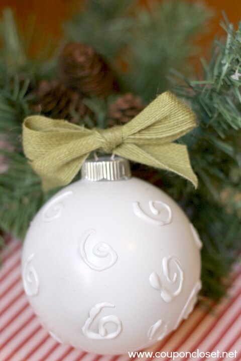 white ornament with embossed swirls