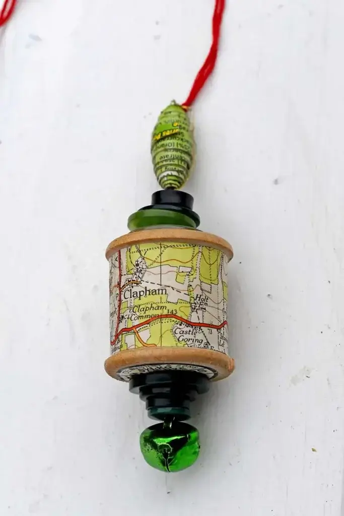 spool ornament with a map on it
