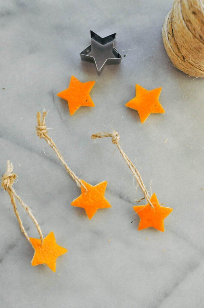 orange peels cut into star shapes and made into ornaments