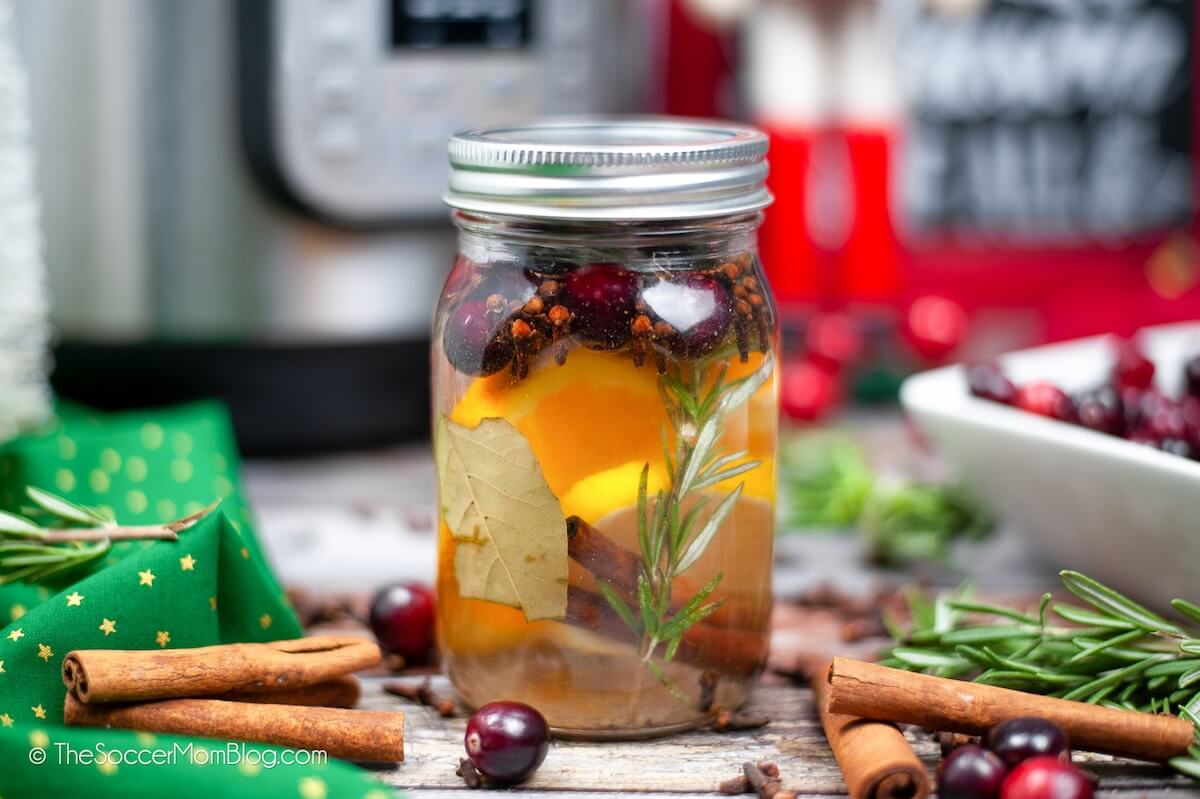 mason jar filled with fruit and spices to make homemade Christmas potpourri