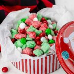 holiday tin filled with homemade Christmas Puppy Chow, red and green snack mix