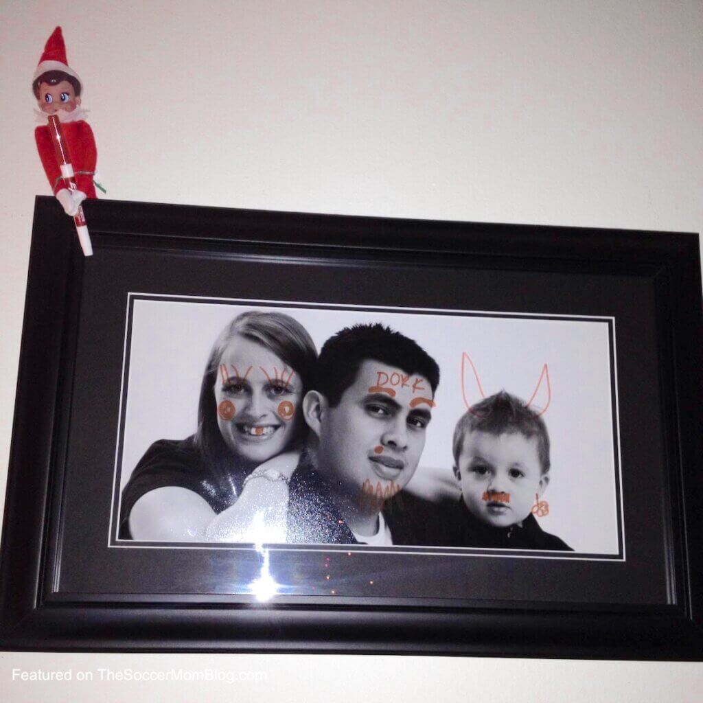 family photo that elf on the shelf drew on the faces