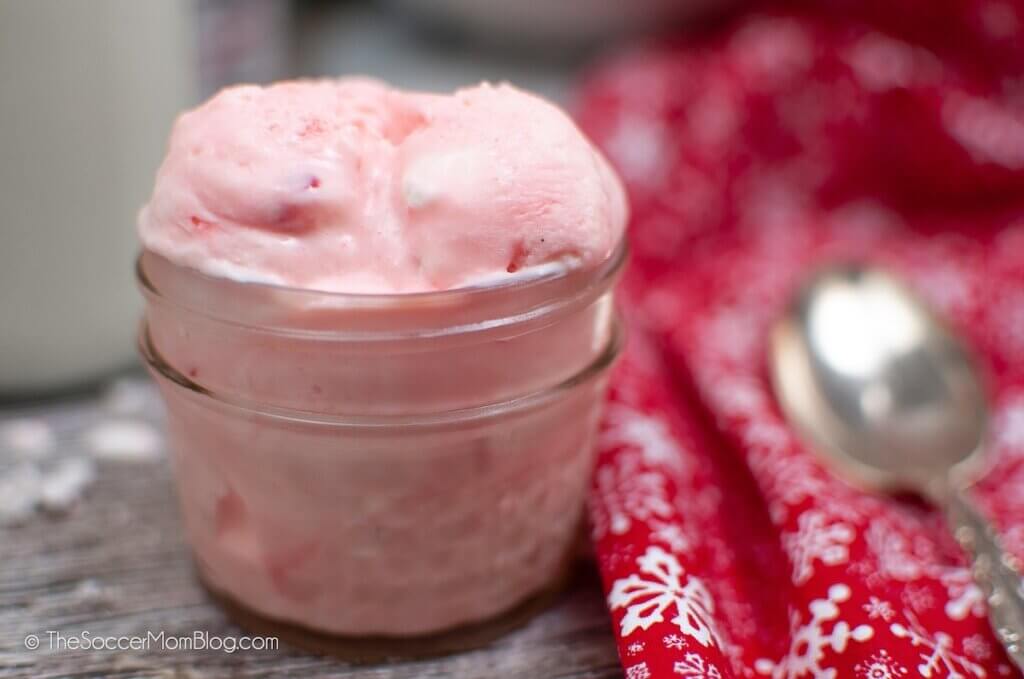 close up of creamy pink Peppermint Ice Cream in a jar