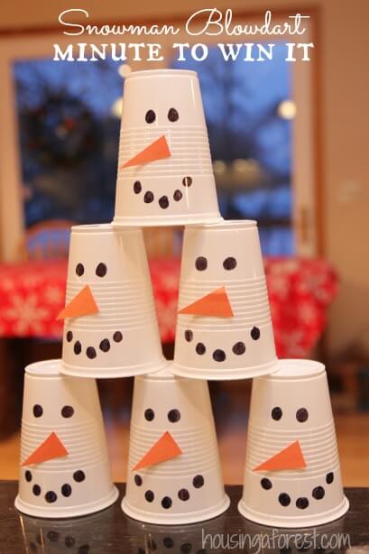 pyramid made of stacked snowmen plastic cups