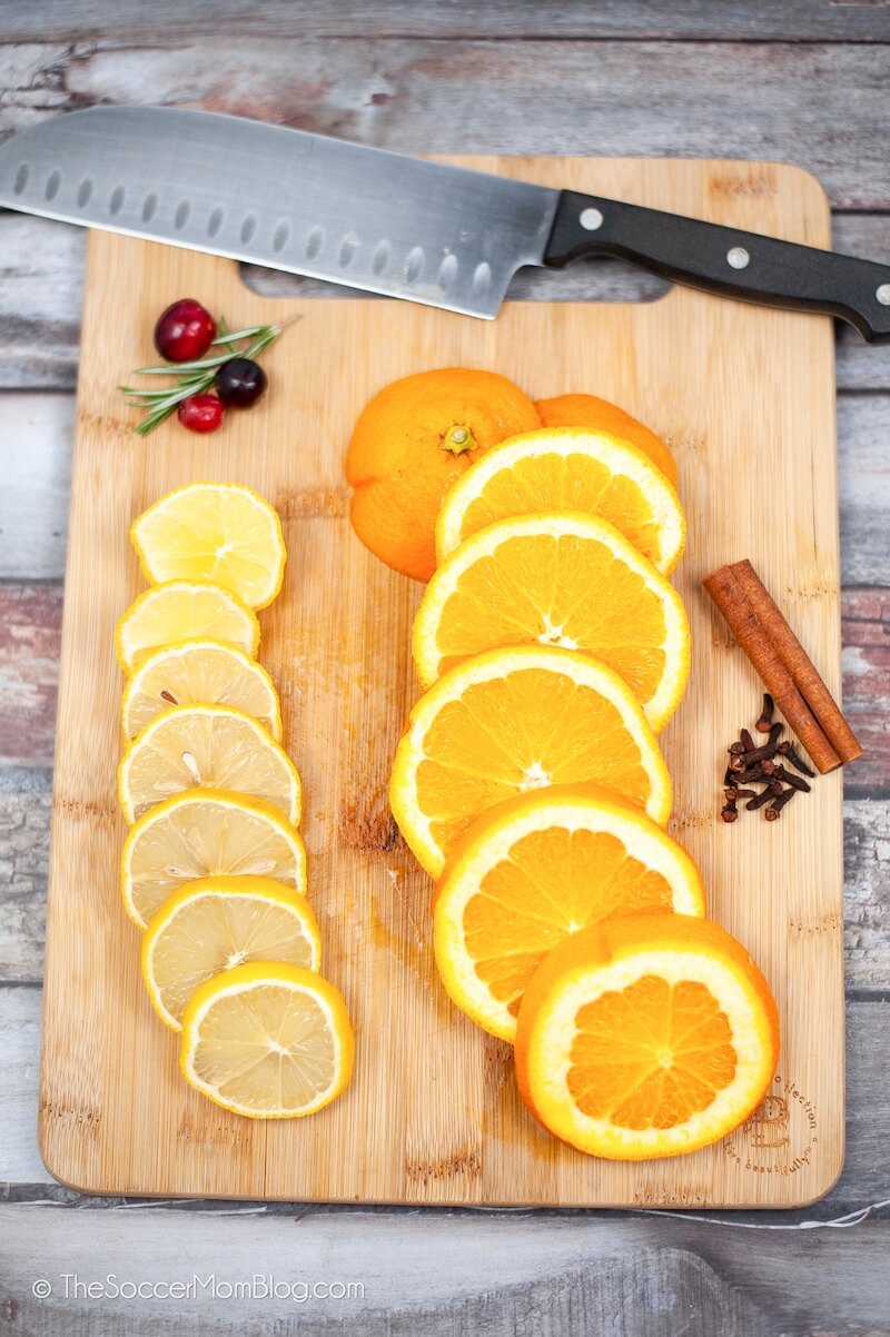 sliced oranges and lemons on cutting board