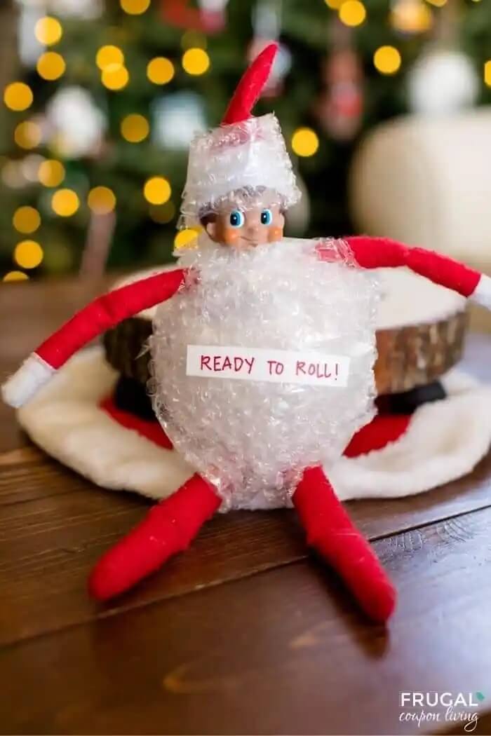 Elf on the Shelf doll wrapped in bubble wrap.