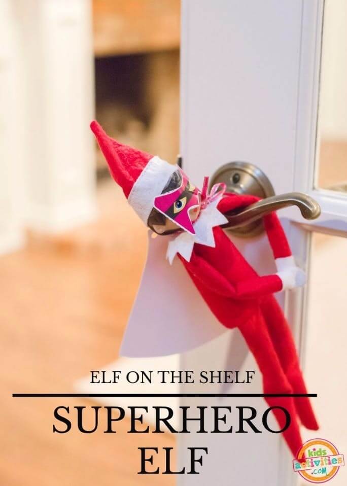 superhero elf hanging on a door knob.